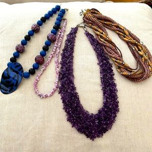 Pretty in purple! Four purple chunky necklaces.